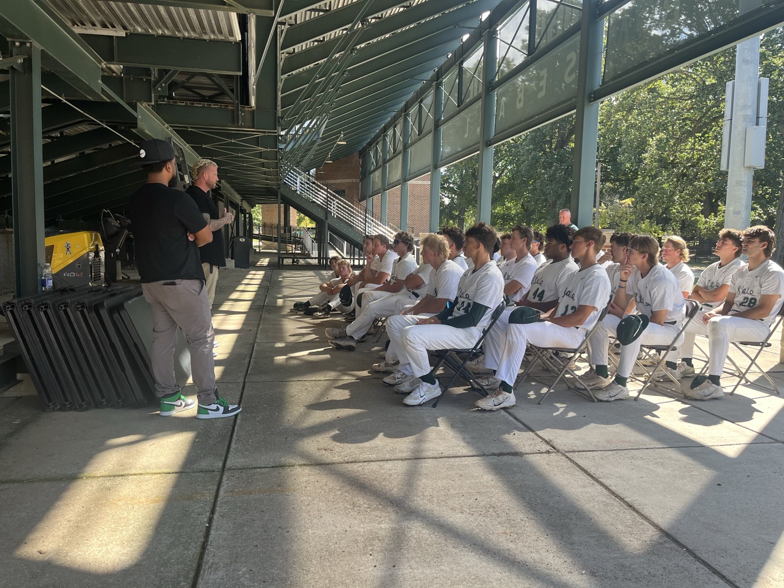 Speaking to a full team under the grandstand